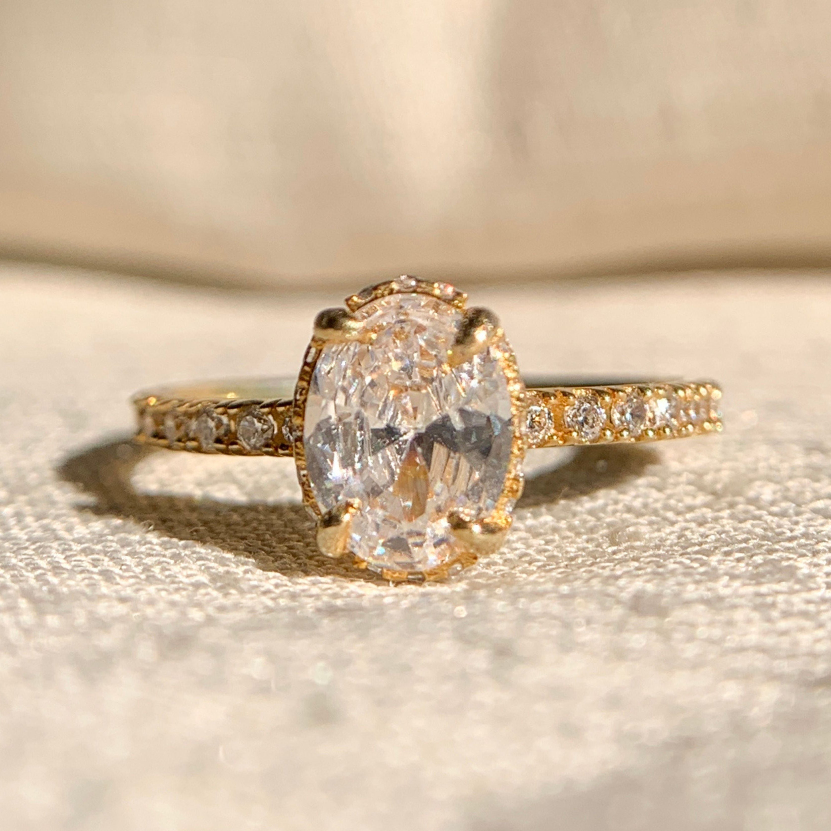 Hidden Halo Oval Engagement Ring with Side Stones